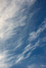 Whispy clouds over ocean.