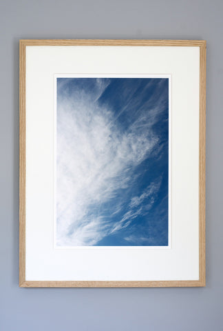 Whispy clouds over ocean.